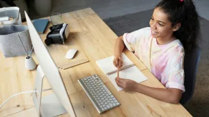 Revolutionary Online Education for K-12 That Fuels Student Success - Smiling student engaged in online education for K-12 at home