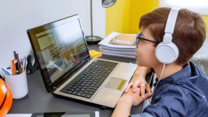 K-12 Online Classes Empower Student Success: The Ultimate Truth - IVLA student participating in K-12 online classes on a laptop
